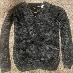Small black SO sweater with cross-stitch back